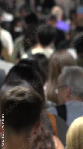 Wallpaper Mural TOKYO, JAPAN - AUG 2025 : Time lapse shot of crowd of people walking at busy downtown area in busy night rush hour. Japanese people, urban city life and lifestyle concept vertical video. Torontodigital.ca