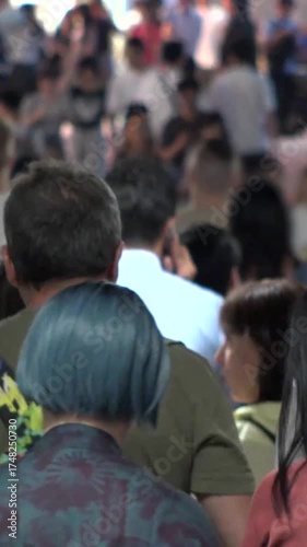 Wallpaper Mural TOKYO, JAPAN - AUG 2025 : Time lapse shot of crowd of people walking at busy downtown area in busy night rush hour. Japanese people, urban city life and lifestyle concept vertical video. Torontodigital.ca