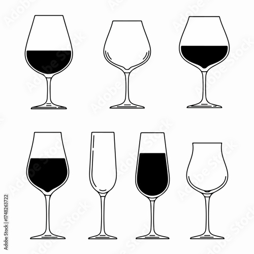 Diverse collection of wine and champagne glasses, including empty and filled vessels, showcasing various drinkware types for celebrations, dining, and beverage service.