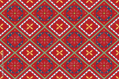 Tribal geometric fabric pattern with red background featuring diamond shapes and floral motifs in yellow, blue, and green. A traditional yet elegant symmetrical design perfect for textiles, clothing, 