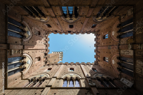 Wide angle view of Torre del Mangia at Palazzo Pubblico in Siena, Italy