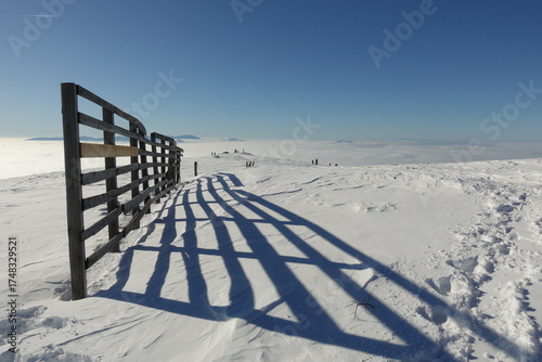 Winter landscapes of the old mountain. Stara Planina Ski Center in winter, ski slopes, clear blue sky above the snowy peaks of Stara Planina 