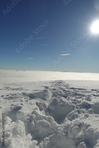 Winter landscapes of the old mountain. Stara Planina Ski Center in winter, ski slopes, clear blue sky above the snowy peaks of Stara Planina 