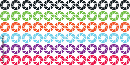 Pattern of black aperture shapes on a light blue background surface