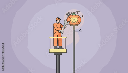 Worker on a lift adjusting a glowing Halloween jackolantern decoration Seasonal maintenance