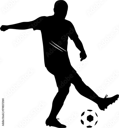 Silhouette of soccer player kicking ball
