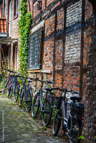 Bicycles parked in an alley, Lüneburg, Germany