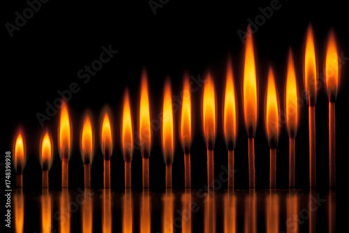 Ascending Flame Sequence: An artistic arrangement of burning matches showcases a mesmerizing sequence of ignited flames.