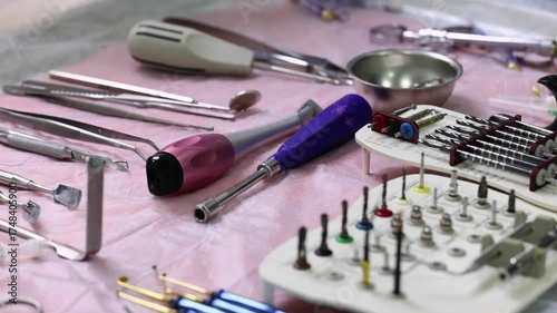 Various dental surgeon's implantation instruments on a table