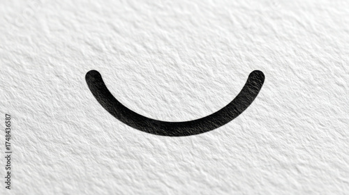 Minimalist smile icon, black on white, representing happiness and positive emotion, with copy space