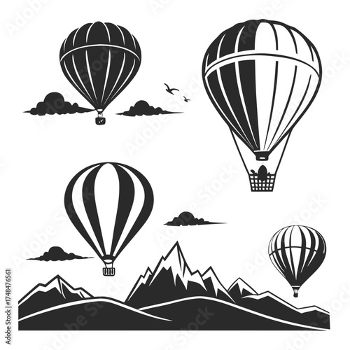 Black silhouette hot air balloons over mountains and clouds