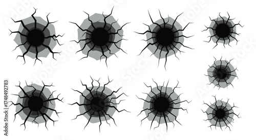 A collection of cracked black holes and circular damage effects with radiating lines and splatter patterns.