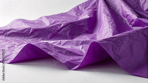 Purple tissue paper artistically draped and folded creating dimensional waves with gradient shading from light to deep violet.