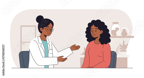 Friendly female doctor of color providing medical advice and support to a young woman patient during a clinic consultation