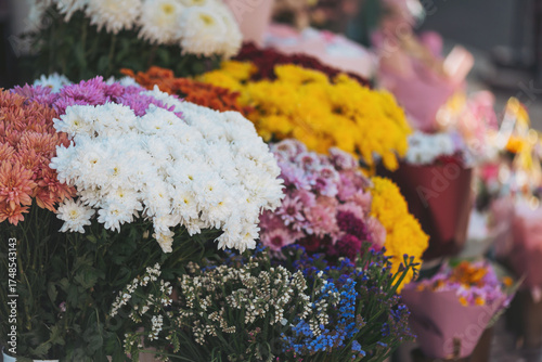 Vibrant flowers in a bustling market reflecting the lively atmosphere of a sunny day