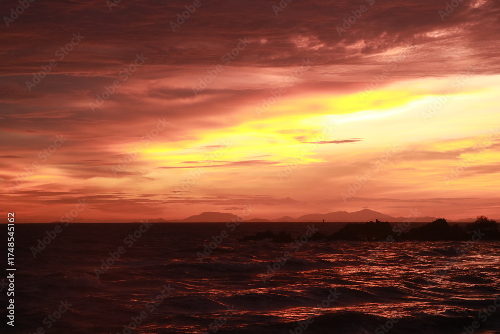 Fototapeta premium black orange sunset over the sea