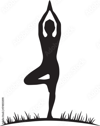 Black silhouette of person in yoga tree pose on grass