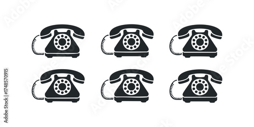 Six black rotary telephones arranged in two rows