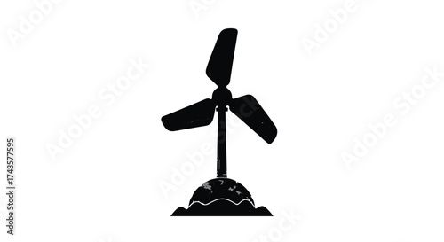 Silhouette of a wind turbine standing on a small island, representing renewable energy and environmental technology.
