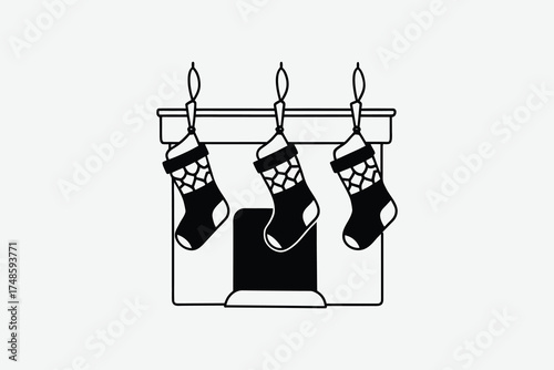 Hanging christmas stockings above a fireplace in black and white silhouette