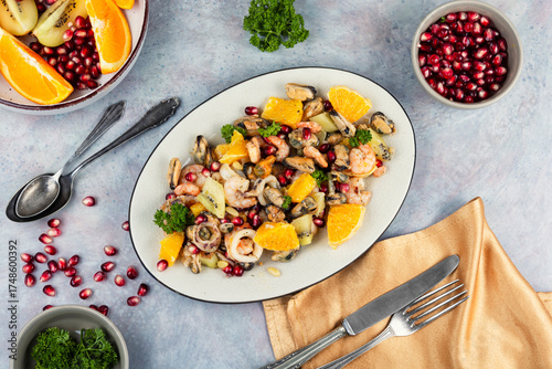 Appetizing salad of seafood and citrus fruits.