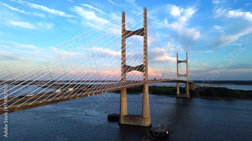  Sunset colors bring out every architectural detail. Aerial view of Jacksonville’s iconic suspension bridge at sunset
