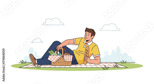 Relaxed Man Enjoying Picnic With Bread And Basket On A Cloudy Day Outdoors