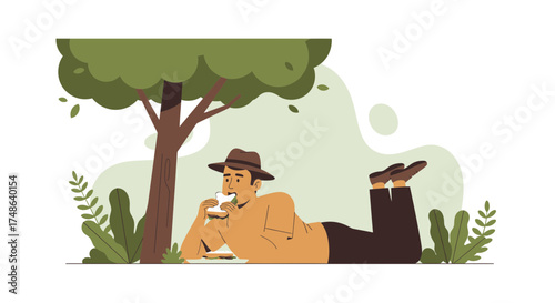 Relaxed Man Enjoying Sandwich Beneath Tree During Peaceful Afternoon Outing