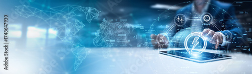 Businessman using tab and analysis energy technology data. renewable energy solutions, smart grid management, solar power integration, battery storage optimization, wind turbine monitoring