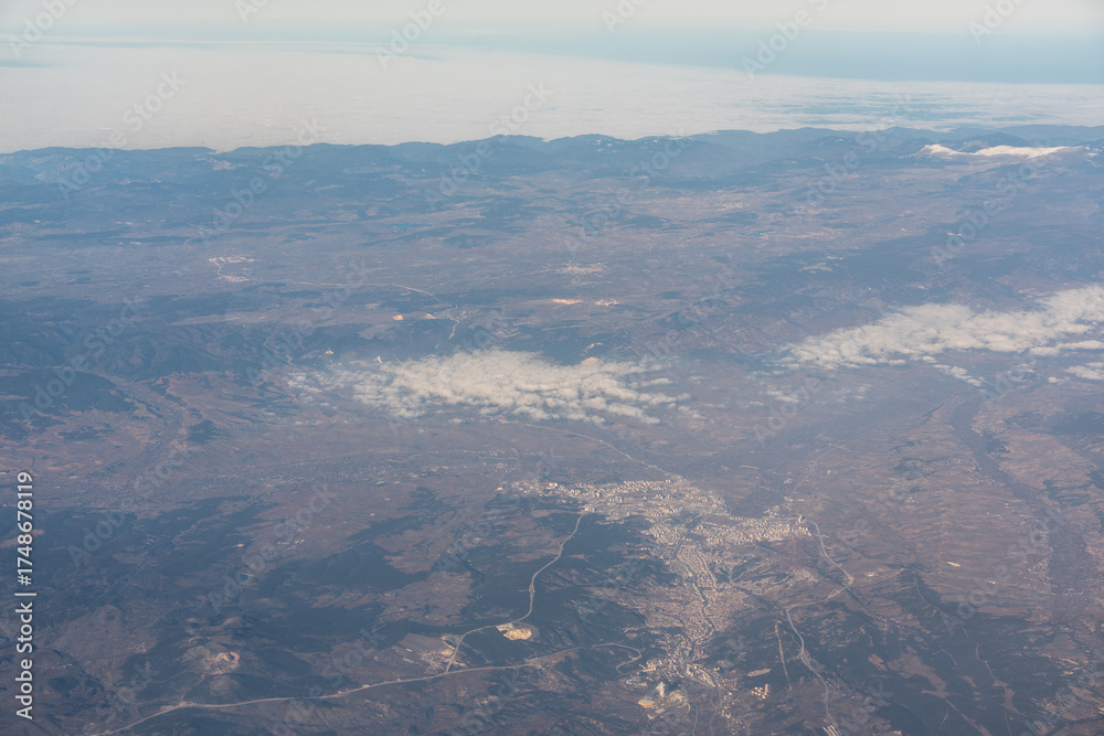 Fototapeta premium Plane Window View, Fields, Villages and Mountains Aircraft Fly Landscape, Looking from Plane Cabin