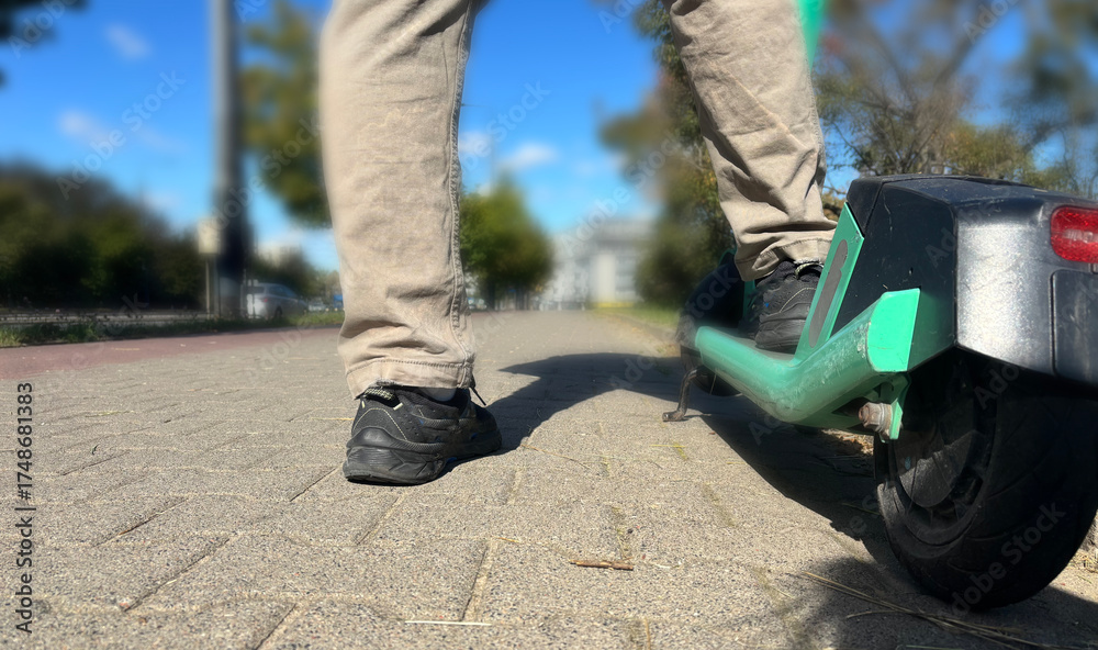 Obraz premium Close up feet on electric scooter