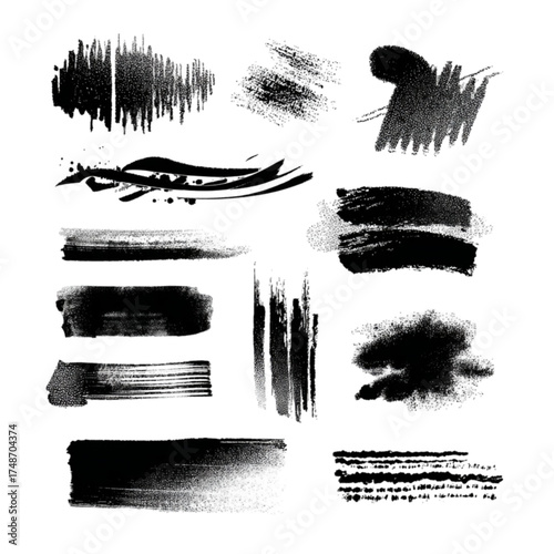 Set of various black ink brush strokes and paint splatters.
