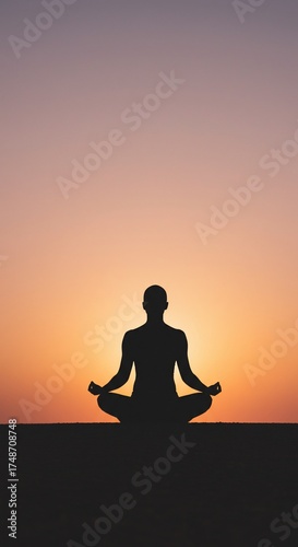 Serene Sunset Meditation: A silhouetted figure finds inner peace and tranquility through meditation during the warm embrace of a mesmerizing sunset.