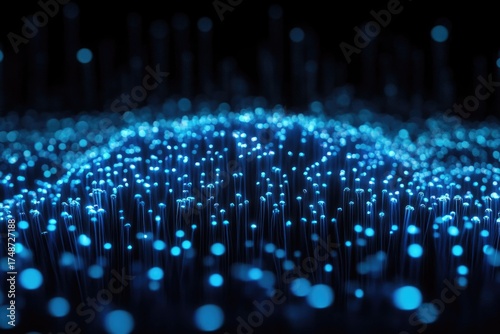 A mesmerizing abstract rendering of glowing blue lights forming an interconnected network, symbolizing data, technology, or digital communication flowing across a dark landscape.