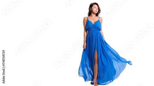 PNG of A confident young woman in a flowing blue dress with a slit, exuding elegance and grace during a fashion photoshoot.