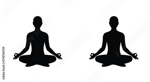 Two silhouettes of people meditating in the lotus position