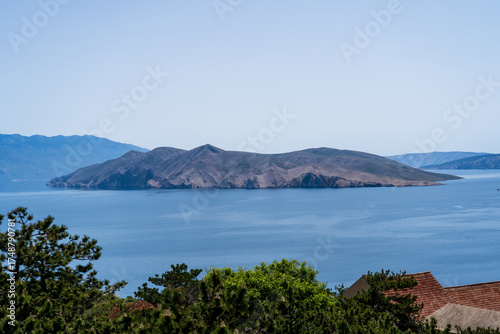Prvić Island and Sveti Grgur, Croatia - April 20, 2025: Panoramic view of the mountains and sea.