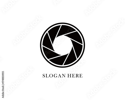 Abstract logo design featuring a circular camera aperture with a slogan beneath it