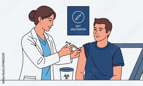 Doctor administering vaccine to young man