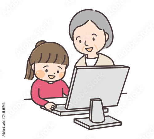 孫と一緒にパソコンで勉強するシニア女性