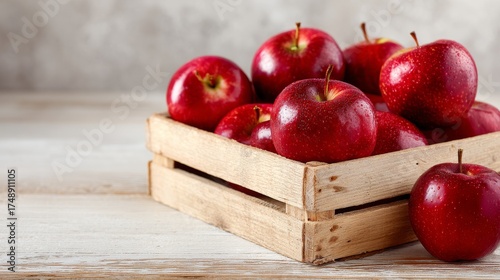 Red apples in a wooden box 