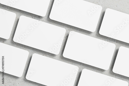 Multiple Blank Business Cards Arranged on a Concrete Surface
