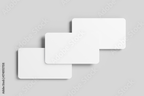 Three Blank Business Cards with Rounded Corners on a Gray Background Mockup