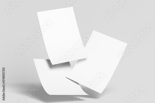 Three Blank White Paper Sheets Dynamically Falling with Soft Shadows