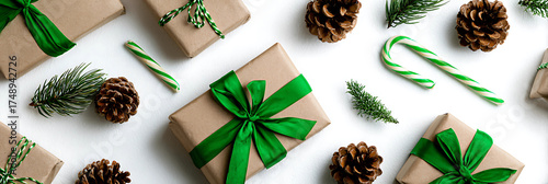 Festive christmas gifts wrapped in kraft paper with green ribbons and pine cones