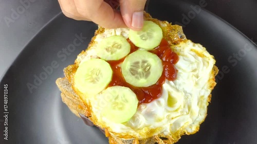 Man is making a sandwich, indoor Chiangmai Thailand.