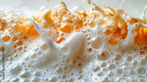 Milk and caramel splash.  Close-up view of creamy milk with caramel splashes and bubbles.