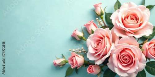 A Delicate Arrangement of Pale Pink Roses on a Light Blue Background, Perfect for Invitations or Greeting Cards