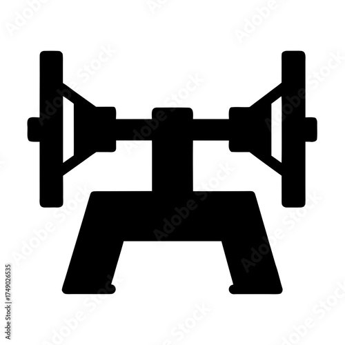 Black silhouette of a vintage industrial grinding wheel machine
