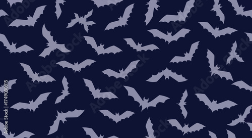 Flying bats in a seamless pattern for Halloween.